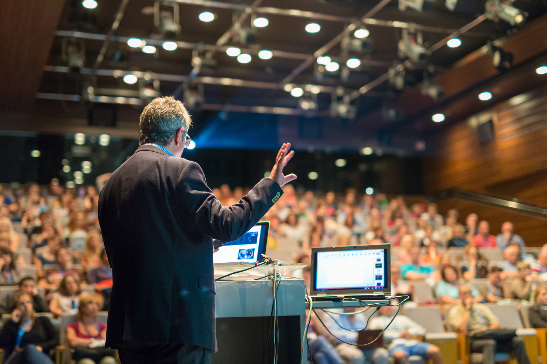 Public Speaker Giving Talk at Business Event.